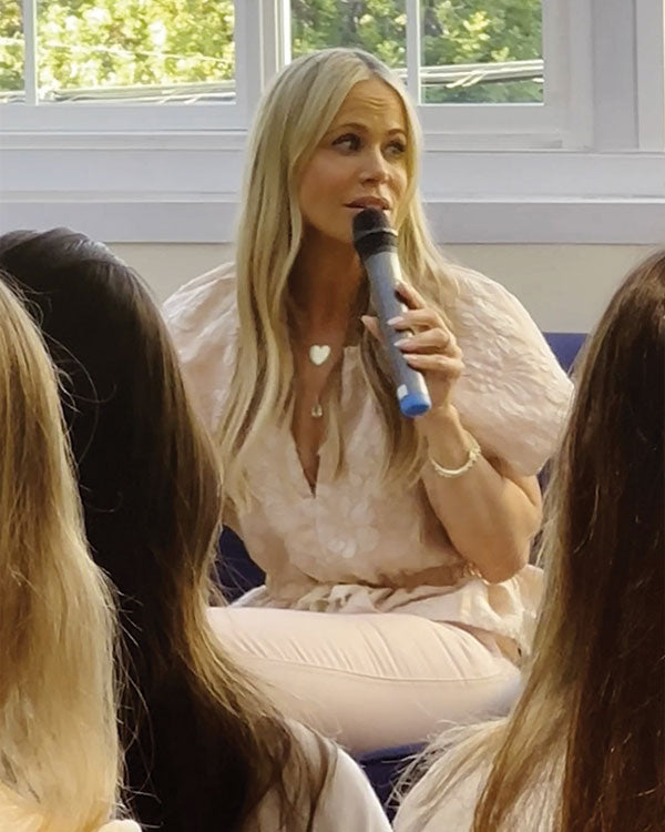 Melinda Speaking to a group